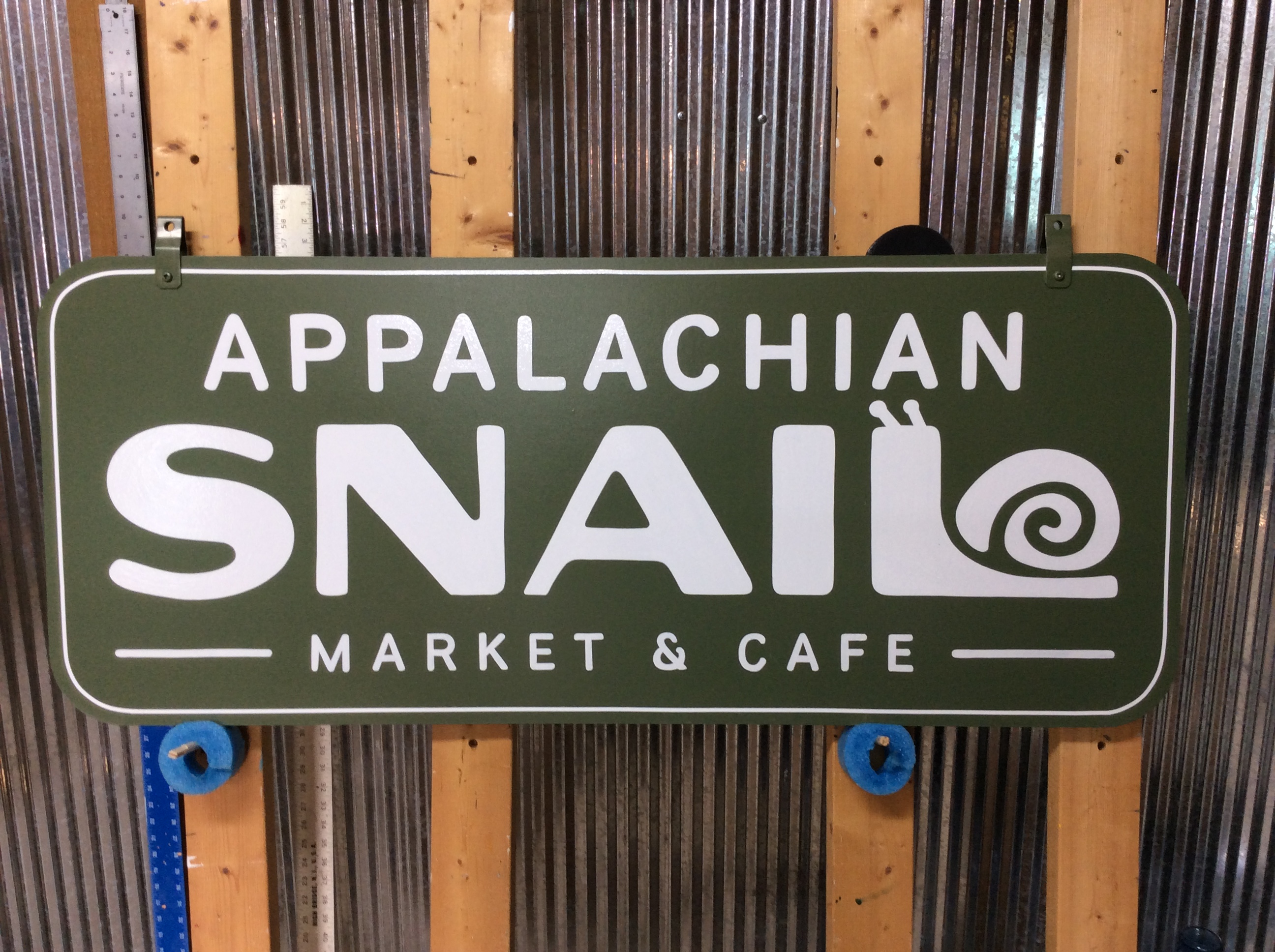 Hand-painted storefront sign example